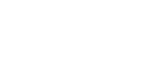 The Train Shed is constructed from timber with a tiled or shingled roof.